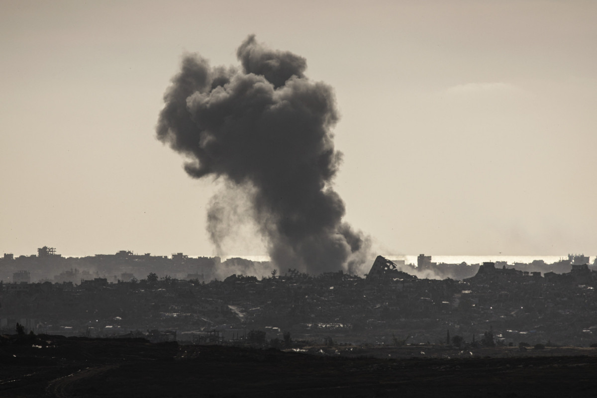  This picture taken from the Israeli side of the border with the Gaza Strip shows smoke plumes rising above destroyed buildings following Israeli strikes in the northern Gaza Strip on May 19, 2025. Israel said on May 19 it will "take control" of the whole of Gaza, where aid entered for the first time in more than two months as rescuers reported dozens killed in a newly intensified offensive. 
      Caption