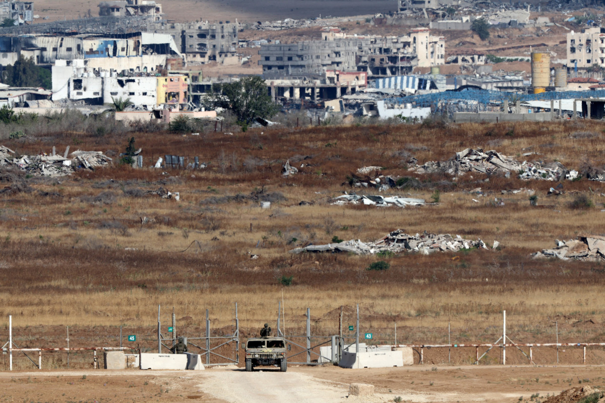  Israeli troops deploy at a position by Israel's border with the Gaza Strip on May 20, 2025. Israel's military has announced the expansion of its operations, saying it is aimed at "achieving all the war's objectives" including releasing hostages and "the defeat of Hamas", the Palestinian movement that runs Gaza. 