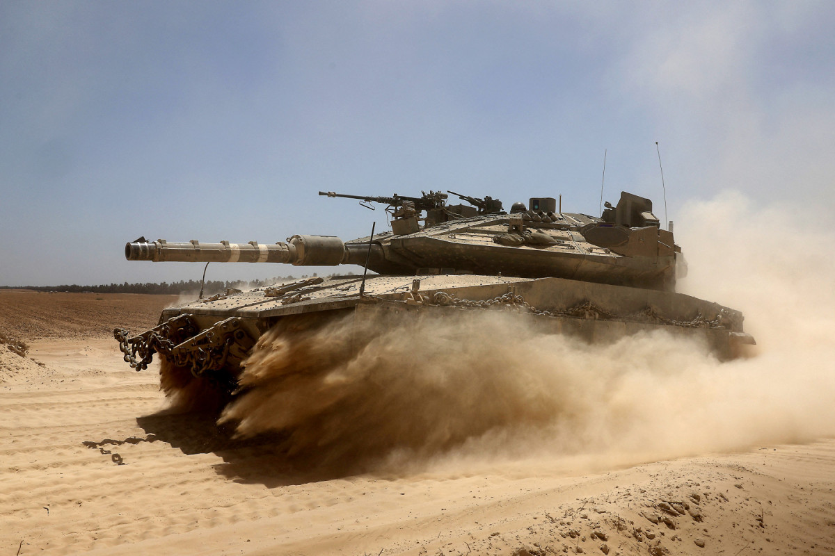  An Israeli military vehicle deploys at Israel's southern border with the Gaza Strip on May 20, 2025 amid the ongoing war with the Palestinian militant movement Hamas. Israel's military has announced the expansion of its operations, saying it is aimed at 