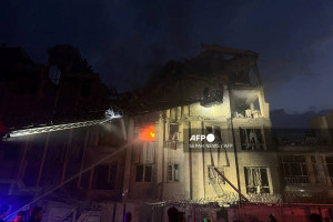  This handout photo released by Iran's Revolutionary Guard Corps (IRGC) official Sepah News Telegram channel on June 13, 2025 reportedly shows a building in Tehran hit in an Israeli strike on the Iranian capital early in the morning. Israeli Prime Minister Benjamin Netanyahu said in a video statement in the early hours of June 13 that Israel carried out strikes on Iran and the military operation against the Islamic republic would  