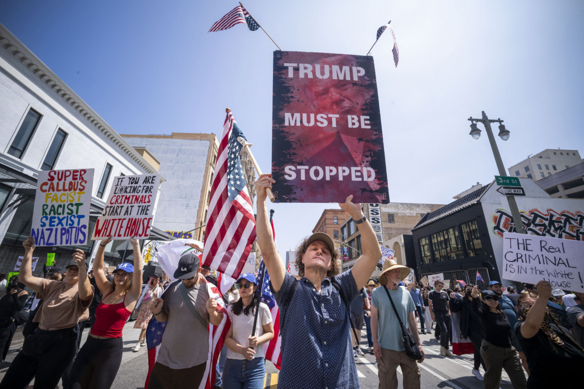 Demonstrators take part in a protest against the Trump administration during the Demonstrators take part in a protest against the Trump administration during the