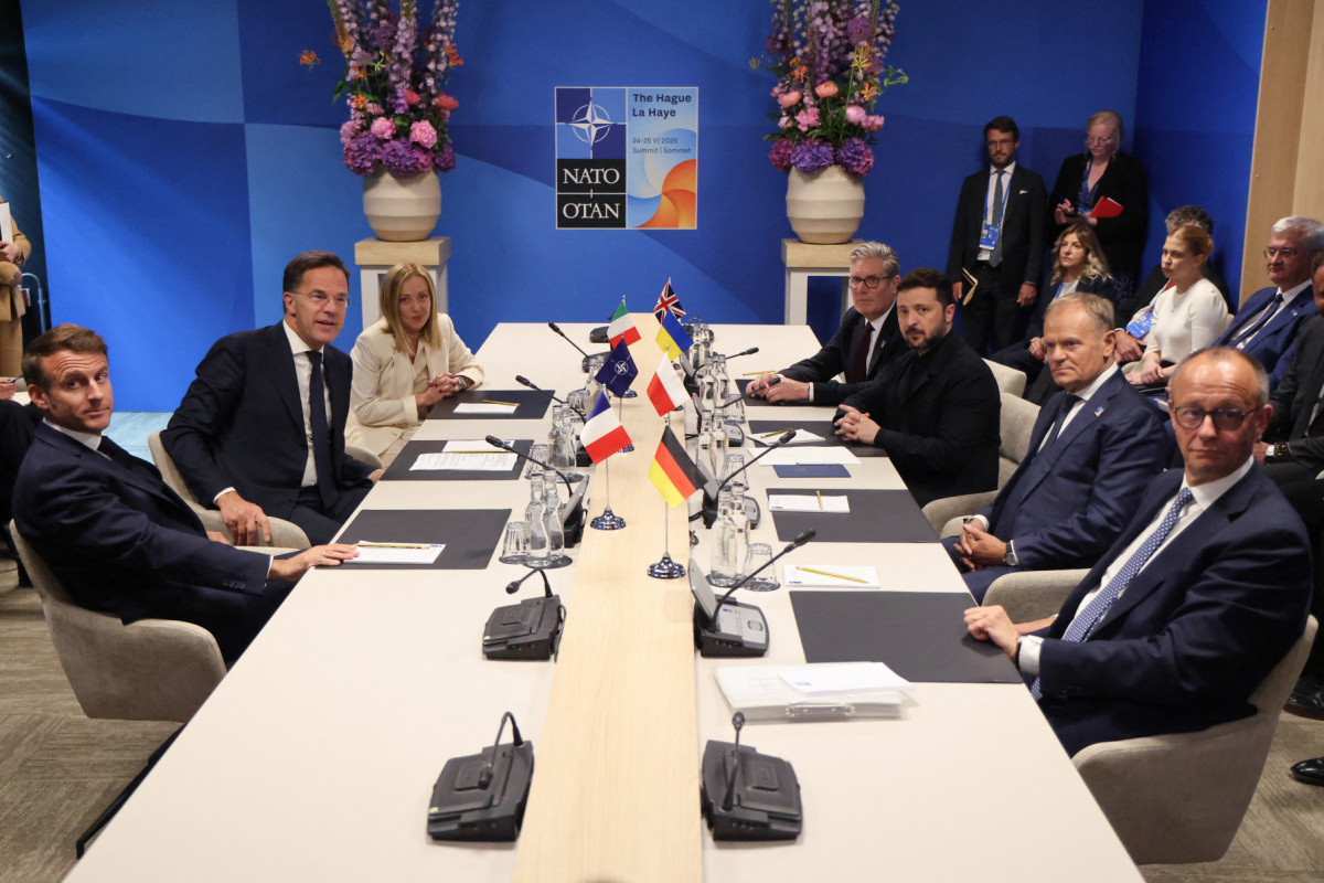 (Clockwise From L) France's President Emmanuel Macron, NATO Secretary General Mark Rutte, Italy's Prime Minister Giorgia Meloni, Britain's Prime Minister Keir Starmer, Ukraine's President Volodymyr Zelensky, Poland's Prime Minister Donald Tusk and Germany's Chancellor Friedrich Merz take part in a meeting between the NATO Secretary General, the president of Ukraine, and leaders of E5 countries during a North Atlantic Treaty Organization (NATO) Heads of State and Government summit in The Hague on June 25, 2025. (Ludovic MARIN / POOL / AFP) (Clockwise From L) France's President Emmanuel Macron, NATO Secretary General Mark Rutte, Italy's Prime Minister Giorgia Meloni, Britain's Prime Minister Keir Starmer, Ukraine's President Volodymyr Zelensky, Poland's Prime Minister Donald Tusk and Germany's Chancellor Friedrich Merz take part in a meeting between the NATO Secretary General, the president of Ukraine, and leaders of E5 countries during a North Atlantic Treaty Organization (NATO) Heads of State and Government summit in The Hague on June 25, 2025. /Ludovic MARIN / POOL / AFP