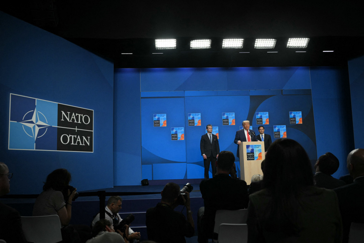  US Defense Secretary Pete Hegseth (L) and US Secretary of State Marco Rubio (R) listen as US President Donald Trump addresses a press conference during a North Atlantic Treaty Organization (NATO) Heads of State and Government summit in The Hague on June 25, 2025. 