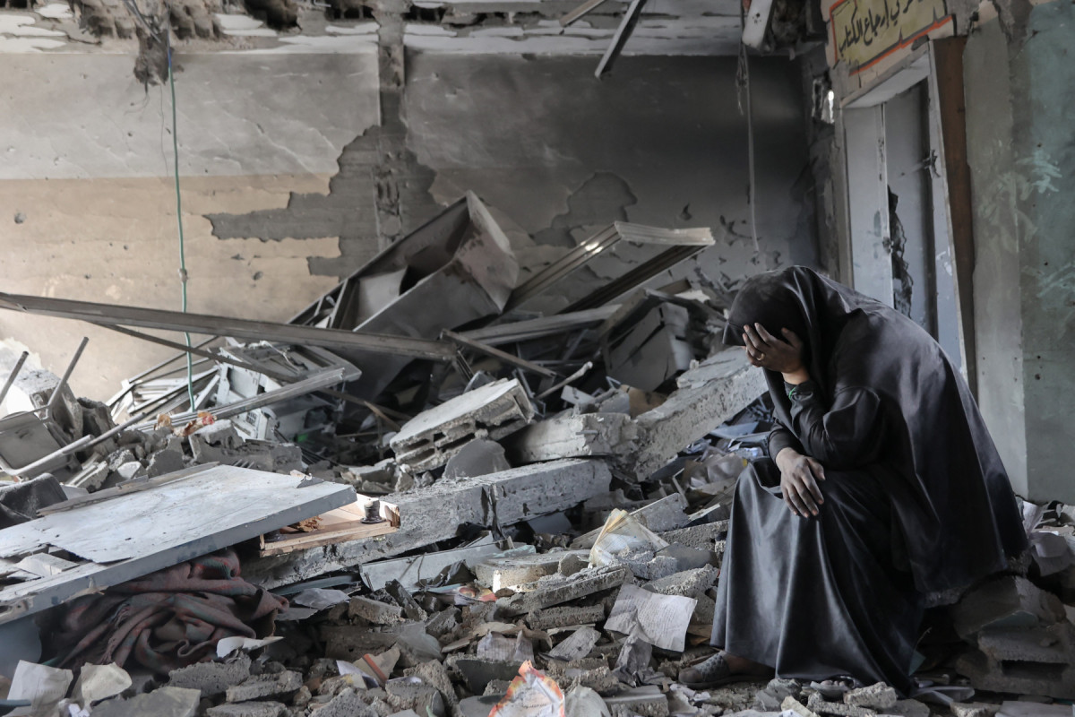  A Palestinian woman reacts as she sits amidst the rubble of Yaffa School in the Tuffah neighbourhood of Gaza City following overnight Israeli strikes, on June 30, 2025, as the was between Israel and the Hamas Islamist militant movement continues. 