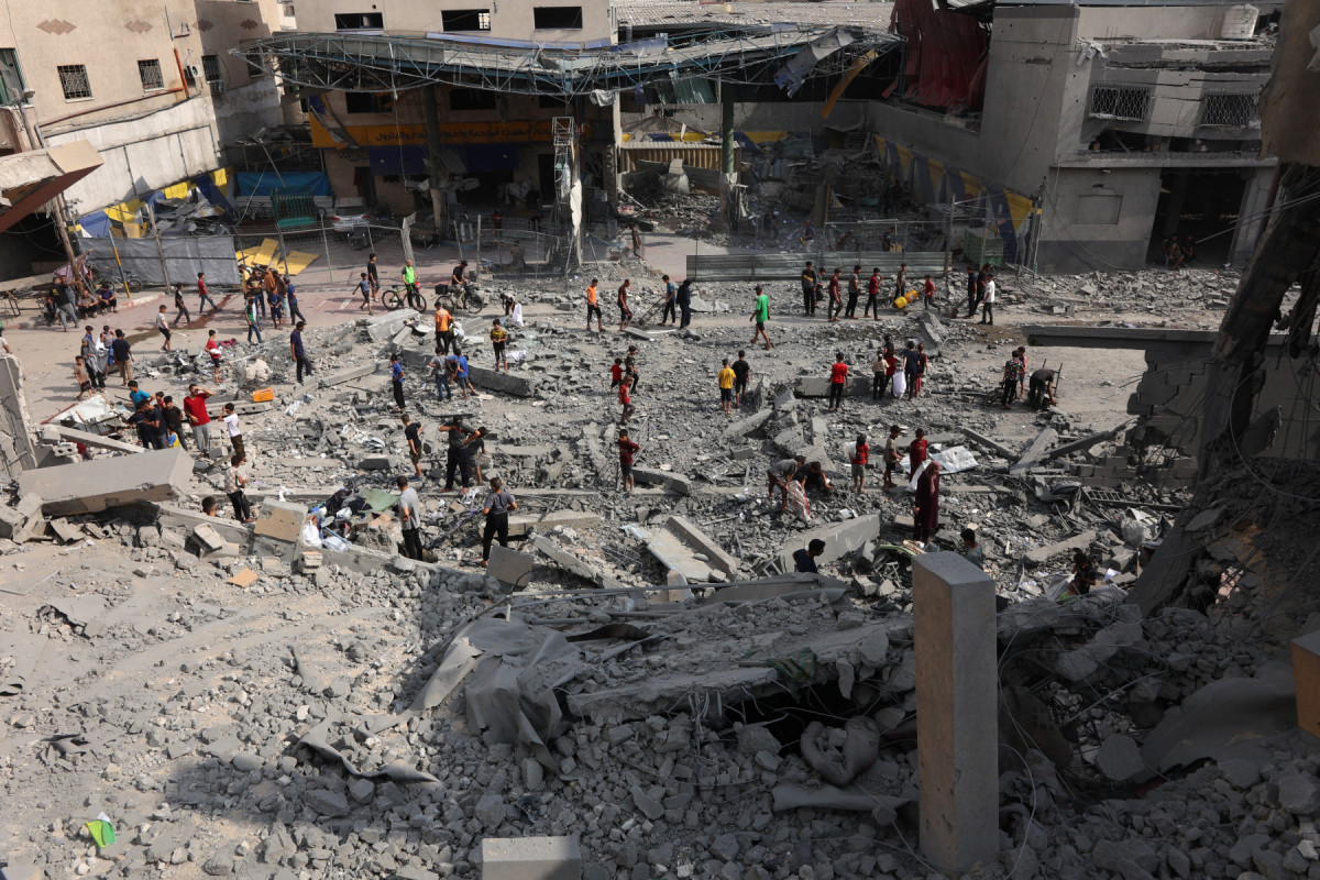  Palestinians check the rubble at the grounds of Yaffa School in the Tuffah neighbourhood of Gaza City following overnight Israeli strikes, on June 30, 2025, as the was between Israel and the Hamas Islamist militant movement continues. 