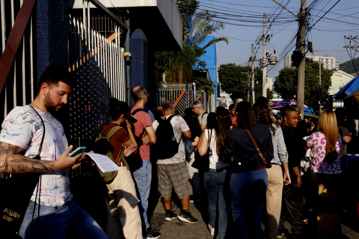 Rio de Janeiro (RJ), 18/08/2024 - Candidatos chegam para as provas do Concurso Público Nacional Unificado (CPNU), na Unisuam, zona norte da cidade. Foto: Tânia Rêgo/Agência Brasil (Tânia Rêgo/Agência Brasil) Rio de Janeiro (RJ), 18/08/2024 - Candidatos chegam para as provas do Concurso Público Nacional Unificado (CPNU), na Unisuam, zona norte da cidade. Foto: Tânia Rêgo/Agência Brasil/Tânia Rêgo/Agência Brasil