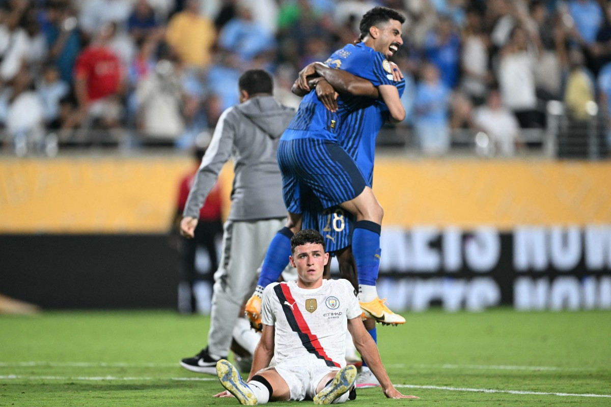 Jogadores do Al Hilal comemoram classificação contra o Manchester City /PATRICIA DE MELO MOREIRA / AFP
