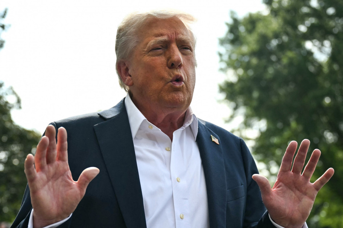  US President Donald Trump speaks to the press before boarding Marine One on the South Lawn of the White House in Washington, DC, on July 11, 2025. Trump is headed to Texas to tour the areas devastated by flash flooding over the Fourth of July weekend which left at least 120 people dead and 170 still missing. (Photo by ANDREW CABALLERO-REYNOLDS / AFP)/ AFP