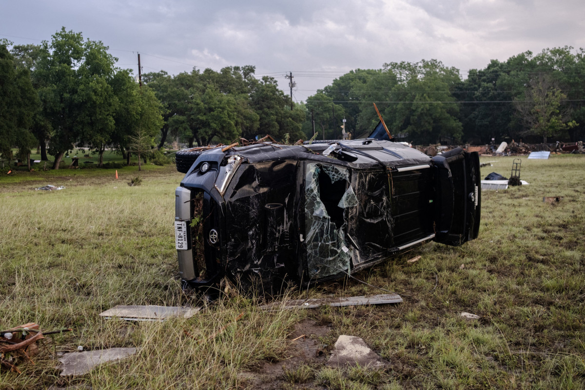  HUNT, TEXAS - JULY 6: A destroyed SUV lays in a field after flash flooding swept through the area on July 6, 2025 in Hunt, Texas. Heavy rainfall caused flooding along the Guadalupe River in central Texas with multiple fatalities reported.  