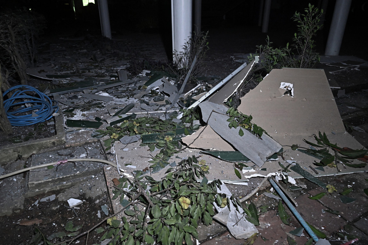  Debris is pictured on the ground at Phanom Dong Rak Hospital, which sustained damage after being hit by Cambodian artillery, in the Thai border province of Surin on July 24, 2025. Thailand launched air strikes on Cambodian military targets on July 24 as Cambodia fired rockets and artillery, killing at least 11 civilians, in a dramatic escalation of a long-running border row between the two neighbours. (Photo by Lillian SUWANRUMPHA / AFP)