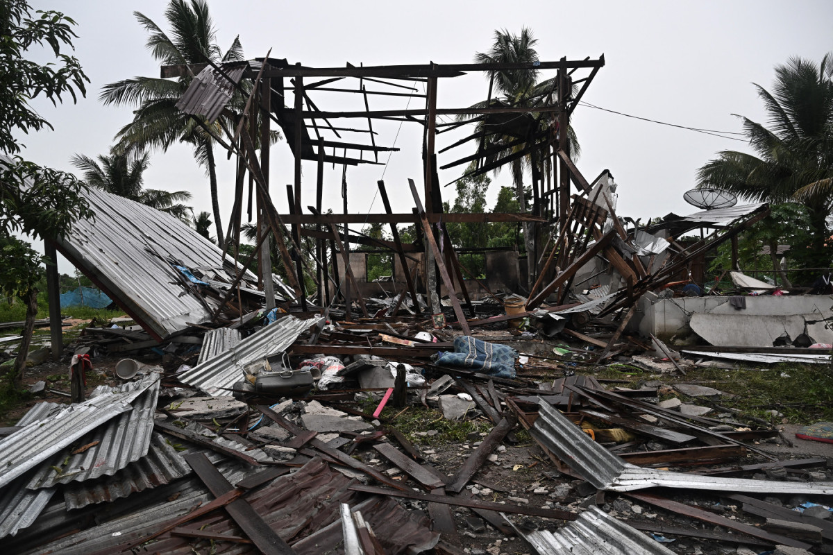  An evacuated house that was destroyed by fire after being hit by Cambodian artillery that morning, is seen in the Thai border province of Surin on July 27, 2025. Thailand and Cambodia clashed for a fourth day on July 27, despite both sides saying they were ready to discuss a ceasefire after a late-night intervention by US President Donald Trump. 