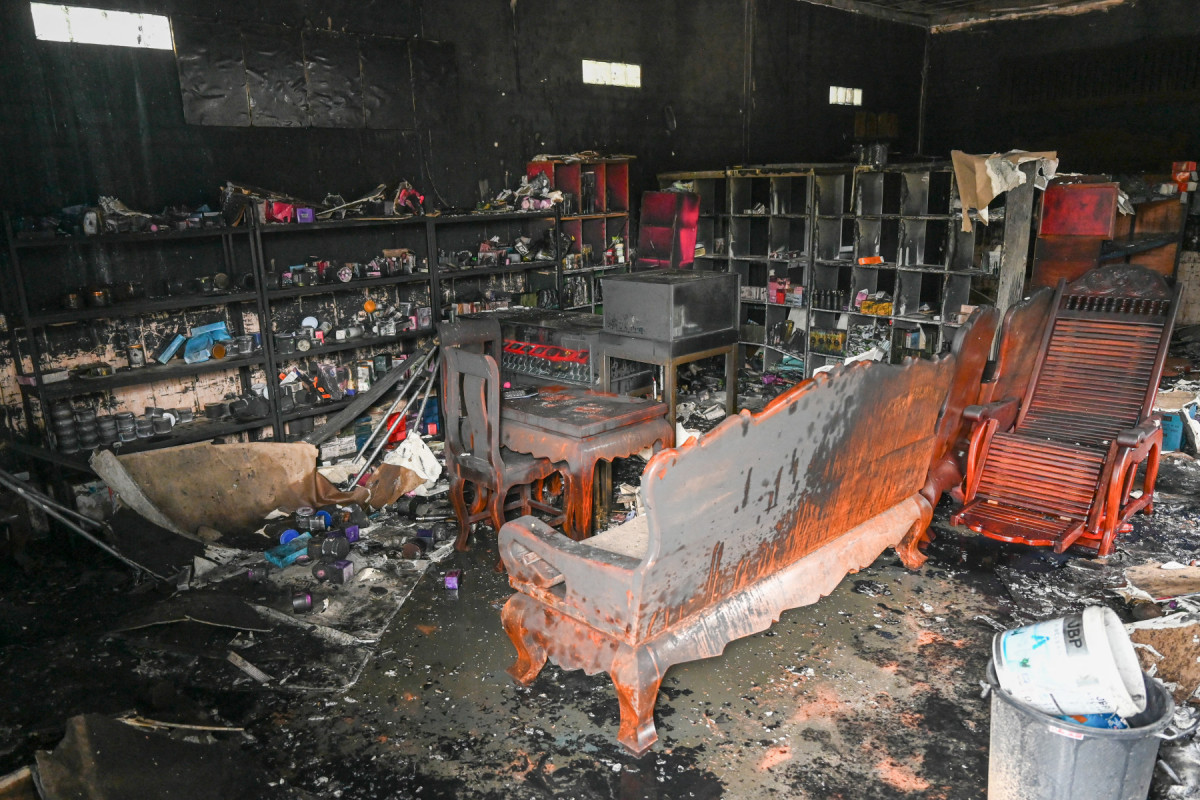  Charred furniture and other items are seen in the interior of a damaged building at a village near the Cambodia-Thailand border in Oddar Meanchey province on July 30, 2025, after cross-border clashes between the two nations killed at least 43 on both sides. Thailand accused Cambodia on July 30 of a 