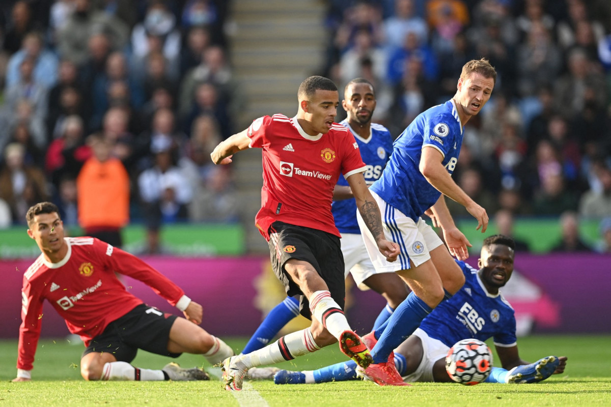 Cristiano Ronaldo e Mason Greenwood jogando juntos no Manchester United /PAUL ELLIS / AFP