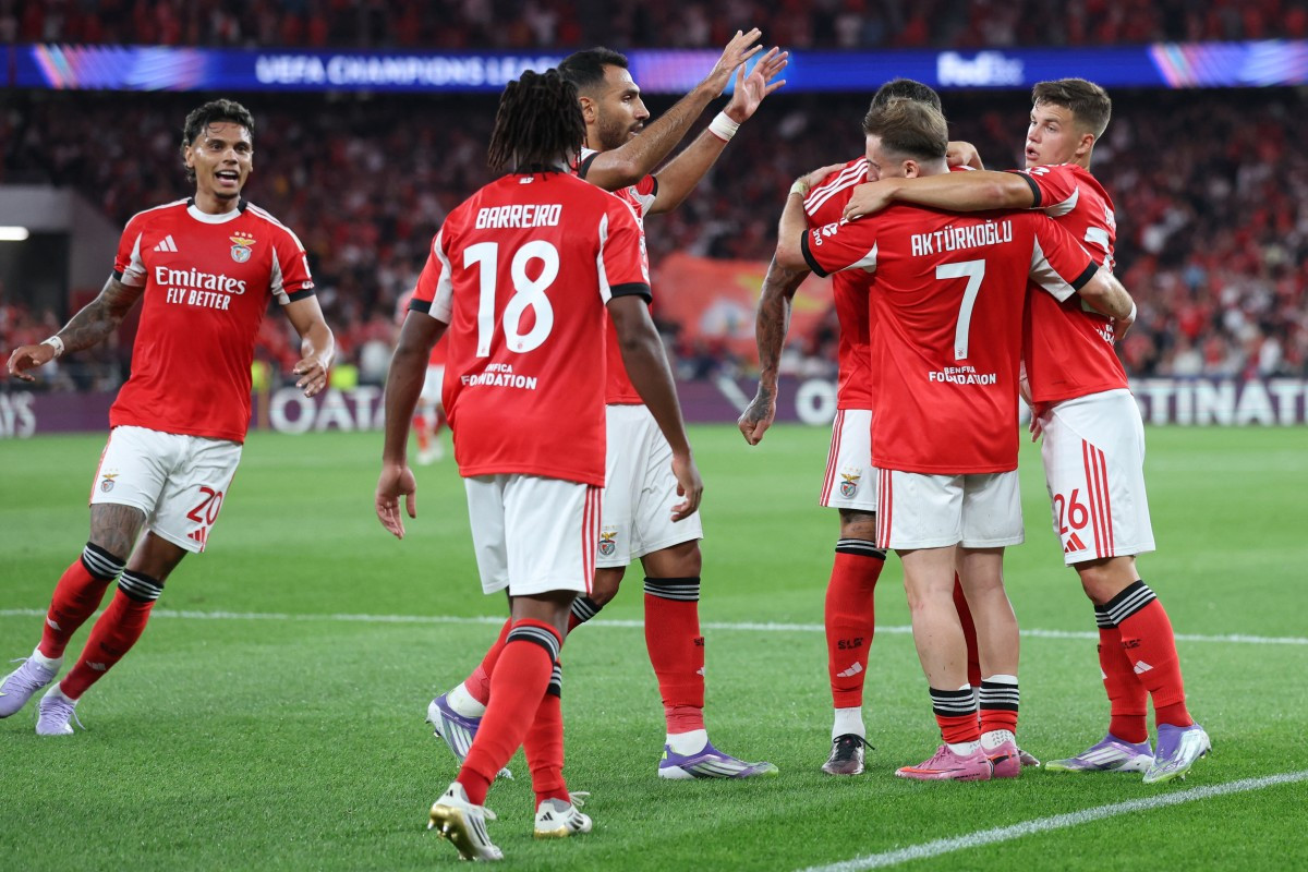 Time do Benfica nos playoffs da Champions League (PATRICIA DE MELO MOREIRA / AFP) Time do Benfica nos playoffs da Champions League/PATRICIA DE MELO MOREIRA / AFP
