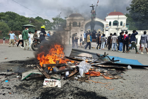 Items are set on fire by protesters during a protest to condemn the police's deadly crackdown on demonstrators in Kathmandu on September 9, 2025, a day after demonstrations over social media prohibitions and corruption by the government. Nepal rolled back its social media ban on September 9, a day after at least 19 people were killed in youth protests demanding that the government lift its restrictions and tackle corruption.