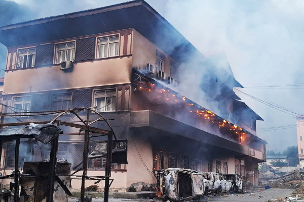 Smoke billows from the burning Supreme Court building, set ablaze by protesters in Kathmandu on September 9, 2025, a day after a police crackdown on demonstrations over social media prohibitions and corruption by the government. Nepal's president called for national unity on September 9, after two days of violent protests, including rallies against a government ban on social media that forced the prime minister to resign and left at least 19 people dead.