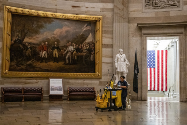  A member of the cleaning staff makes her way through the Rotunda on an empty US Capitol in Washington, DC on September 30, 2025, hours before a partial government shutdown is set to take effect. The US government barreled towards its first shutdown in six years Tuesday, with funding expiring at midnight after Democrats fought a war of words with Donald Trump and senators rejected a last-ditch bid to keep the lights on.  ( ANDREW CABALLERO-REYNOLDS / AFP)