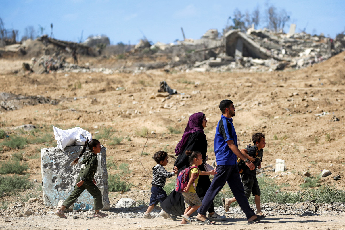  Palestinos a caminho da Cidade de Gaza/EYAD BABA / AFP