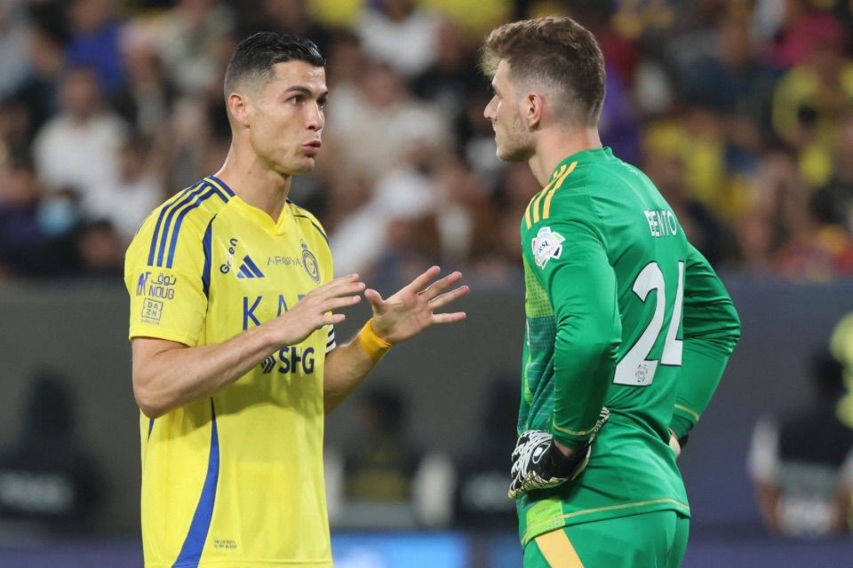 Cristiano Ronaldo e Bento, jogadores do Al-Nassr/FAYEZ NURELDINE / AFP