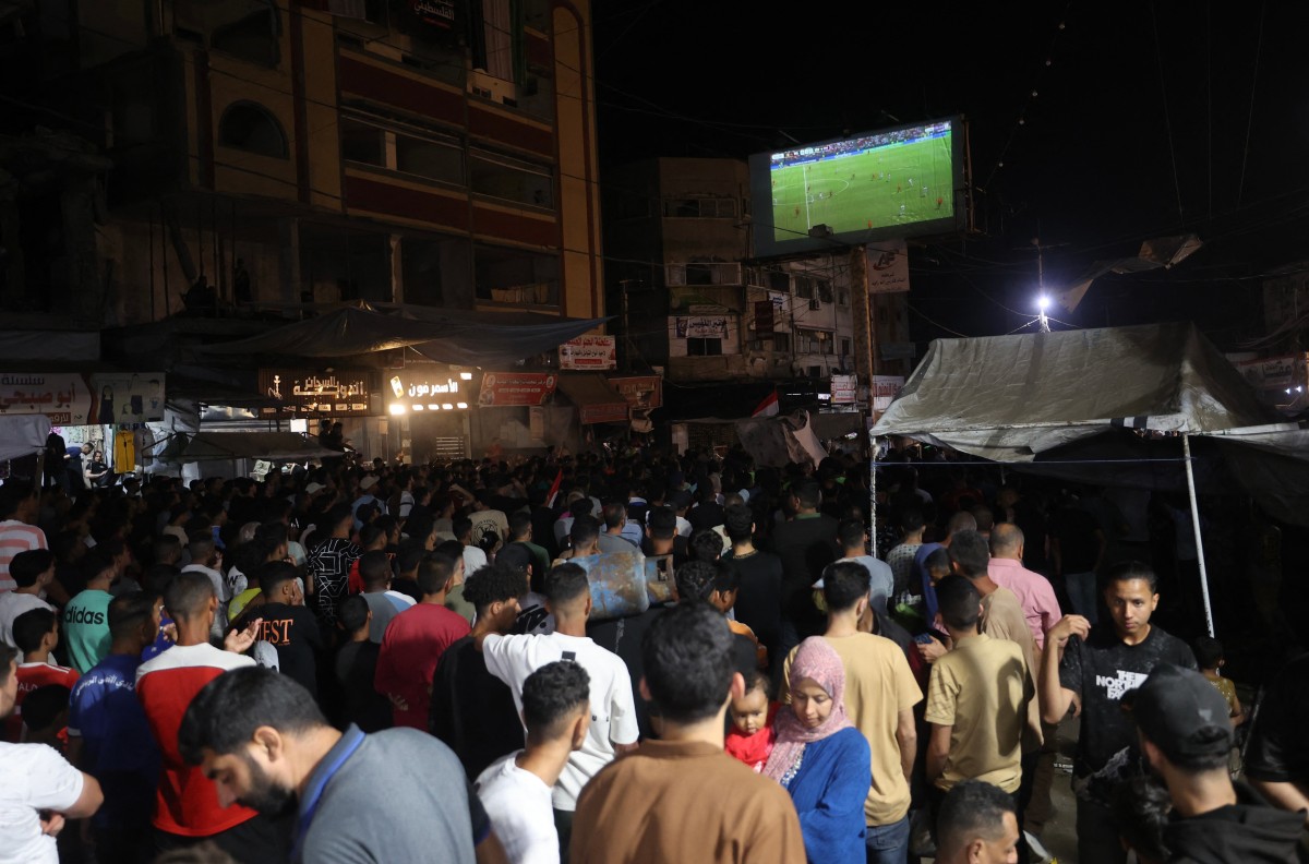 Palestino acompanham a Copa do Mundo /Eyad Baba / AFP