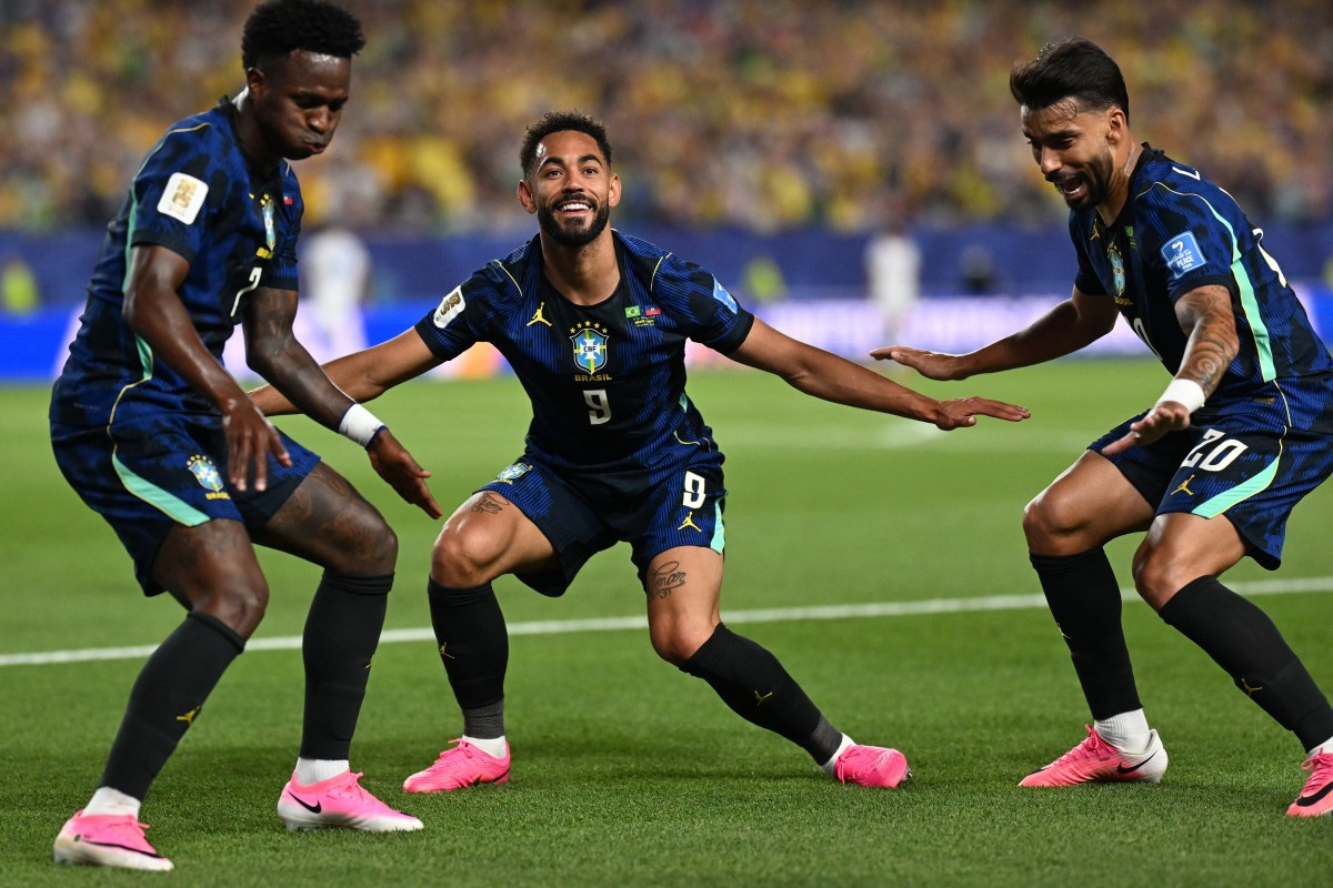 Vini Jr., Matheus Cunha e Lucas Paquetá em comemoração de gol do Brasil contra o Haiti na Copa do Mundo 2026/MAURO PIMENTEL/AFP