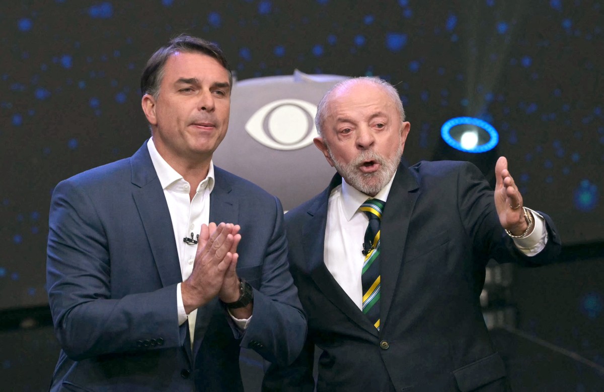Lula e Fl&aacute;vio usam Lulinha e Eduardo Bolsonaro para se atacar em debate na Band - NELSON ALMEIDA / AFP