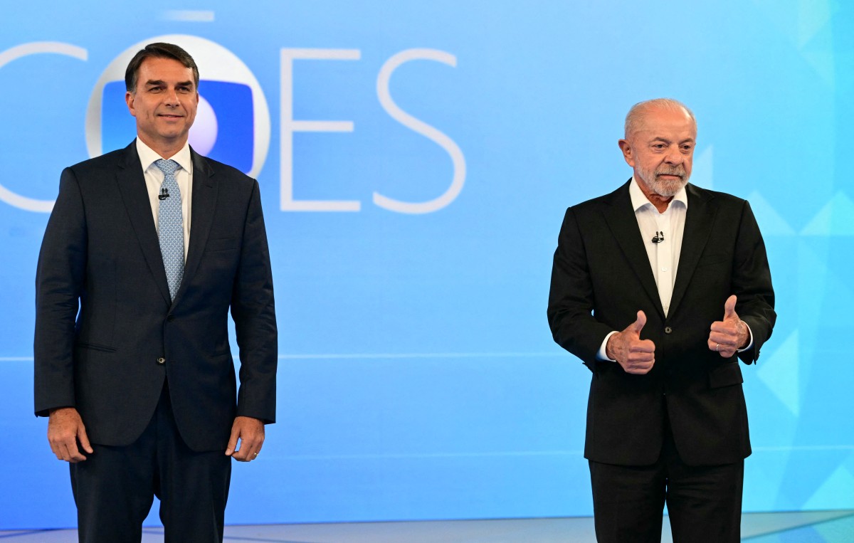 Luiz Inácio Lula da Silva (PT) e Flávio Bolsonaro (PL) se enfrentam no último debate antes do segundo turno das eleições gerais de 2026./Foto: PABLO PORCIUNCULA / AFP