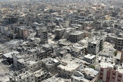 Vista area de edifcios destrudos em Khan Yunis, no sul da Faixa de Gaza, em abril de 2024