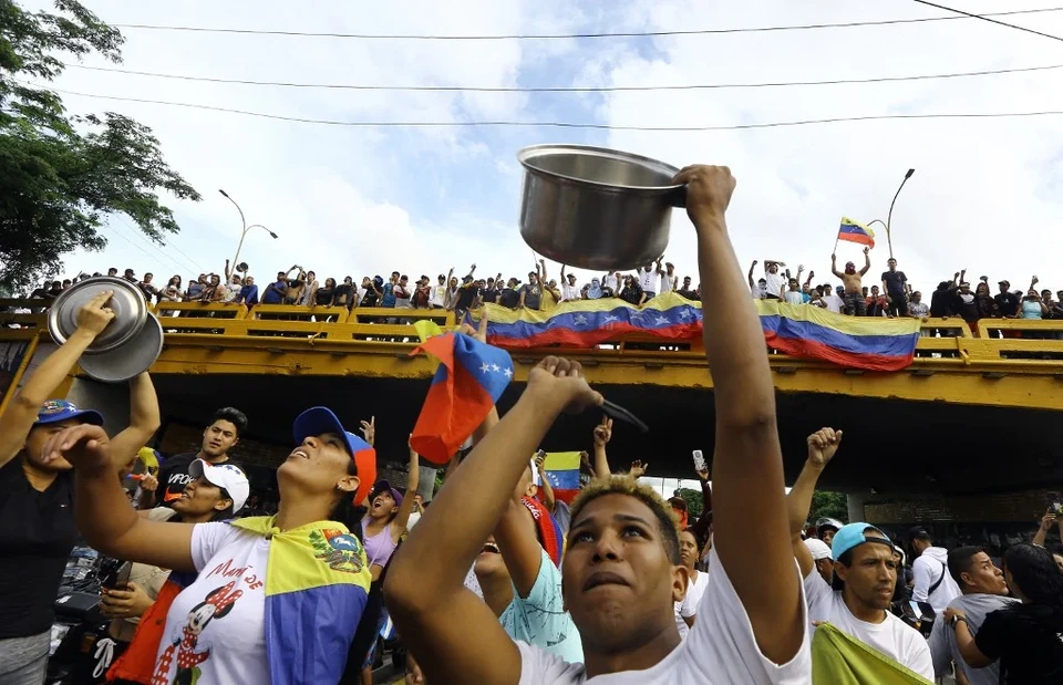 
Protestos contra Maduro na Venezuela (foto: Juan Carlos HERNANDEZ / AFP)