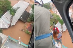 Marinha do Brasil realiza salvamento de famlia ilhada em teto de casa em Canoas (RS)