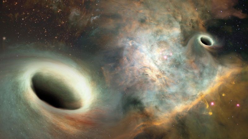 Simulao dos buracos negros gravitando prximos: um orbita o outro h 30 mil anos. Foto: Josh Valenzuela/UNM/Divulgao