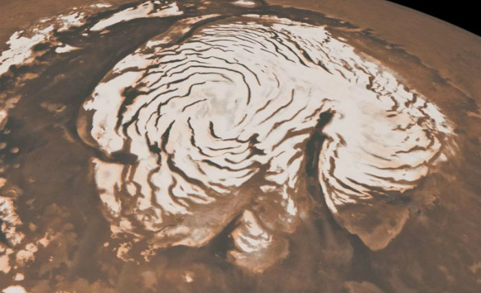 Gelo no polo norte de Marte: a anlise de registros feitos pela sonda Mars Reconnaissance Orbiter permite traar uma histria do clima da regio. Foto: AFP (Foto: AFP)