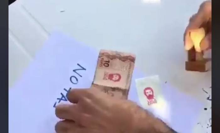 Um vdeo com as notas sendo carimbadas com o rosto de Lula circula nas redes sociais. Foto: Reproduo 