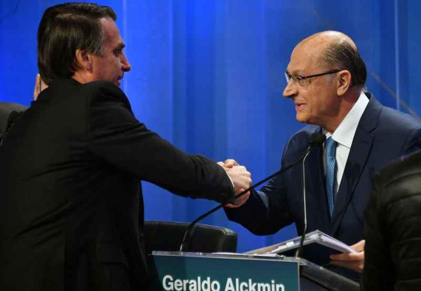 A coligao de Bolsonaro alega que a campanha de Alckmin 'maculou a honra'. Foto: Nelson Almeida/AFP