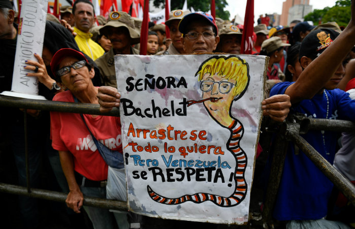 Manifestantes contra o relatrio. Foto: Federico PARRA / AFP