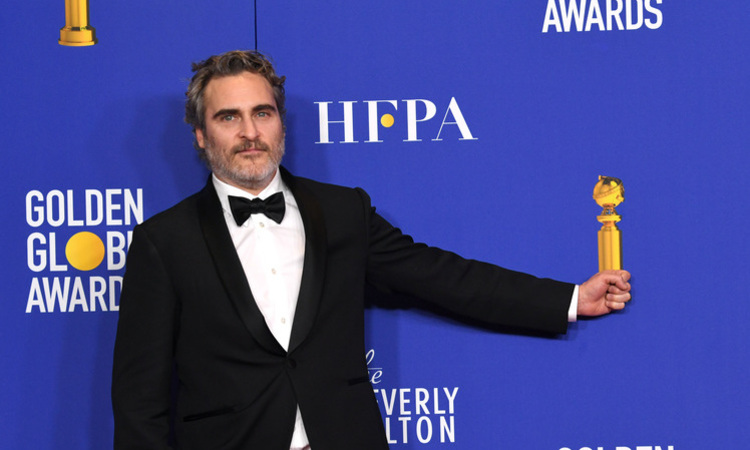 (O favorito Joaquin Phoenix foi o melhor ator de drama, por Coringa. Crdito: Kevin Winter/AFP)