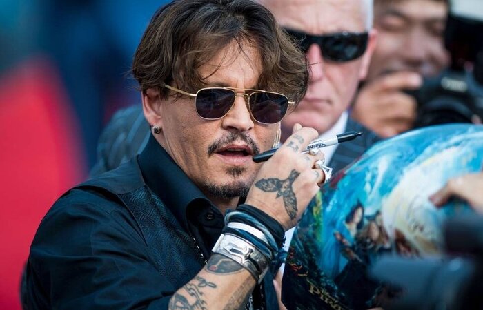 Nos ltimos anos, Johnny Depp esteve envolvido com uma denncia de violncia fsica e mental pela ex-mulher. (Foto: JOHANNES EISELE/AFP)