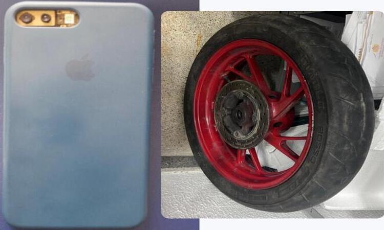Além da roda de uma moto, os policiais apreenderam um celular com queixa de roubo (Foto: Divulgação)